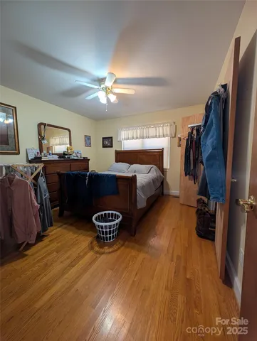 a living room with furniture a ceiling fan and a window