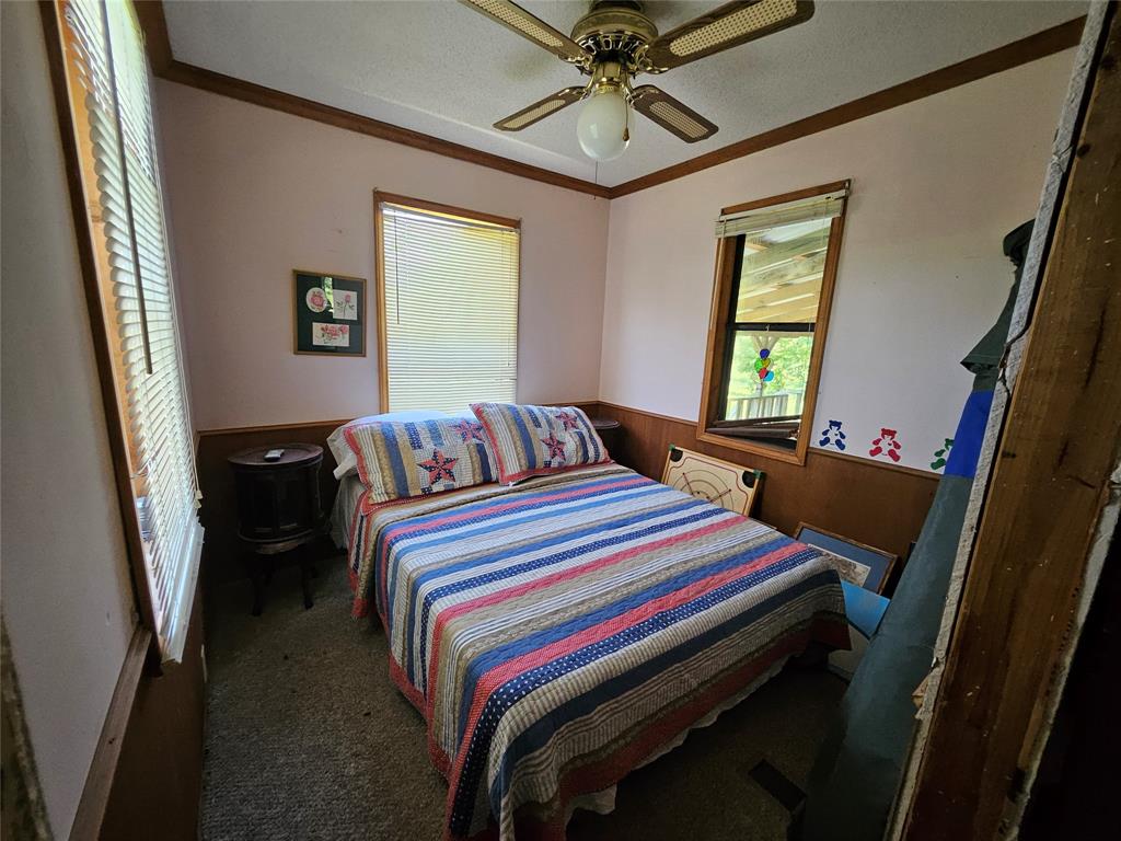 16307 County Road Henderson, TX 75654 - Photo 12 of 27 a bedroom with bed and window