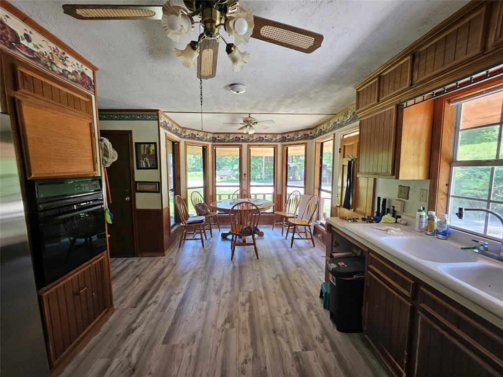 16307 County Road Henderson, TX 75654 - Photo 2 of 27 a kitchen with stainless steel appliances granite countertop a stove and refrigerator