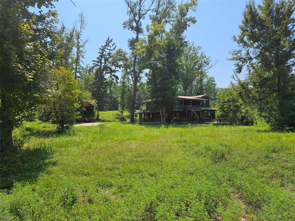 16307 County Road Henderson, TX 75654 - Photo 21 of 27 a view of a backyard with a garden