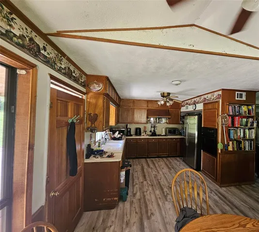 a kitchen with stainless steel appliances lots of counter top space