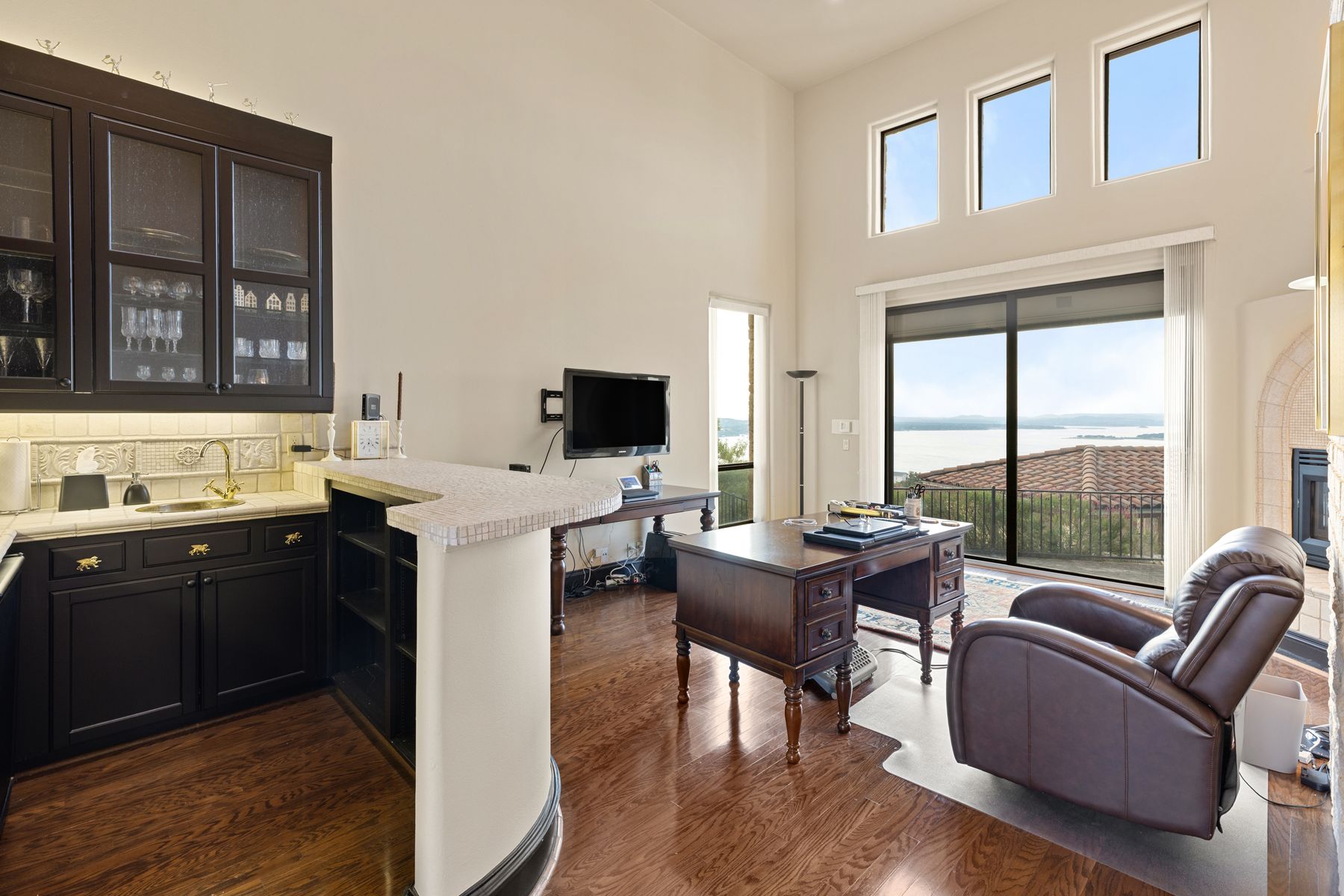 12600 Lyndon Drive Austin, TX 78732 - Photo 11 of 37 a view of living room kitchen with patio furniture and floor to ceiling windows