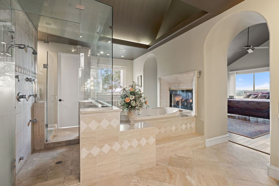 12600 Lyndon Drive Austin, TX 78732 - Photo 16 of 37 a view of a hallway to a livingroom and a chandelier