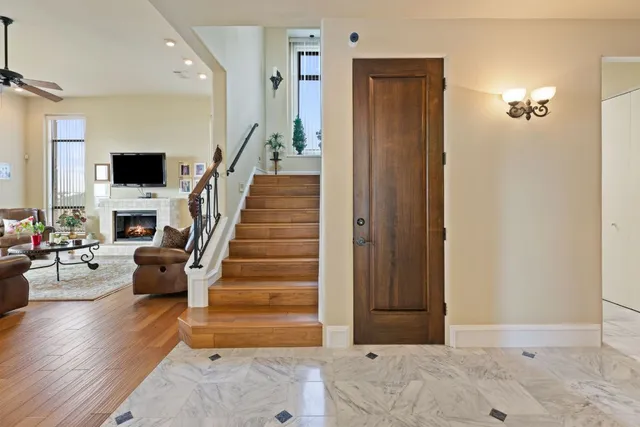 a view of entryway and hall with wooden floor