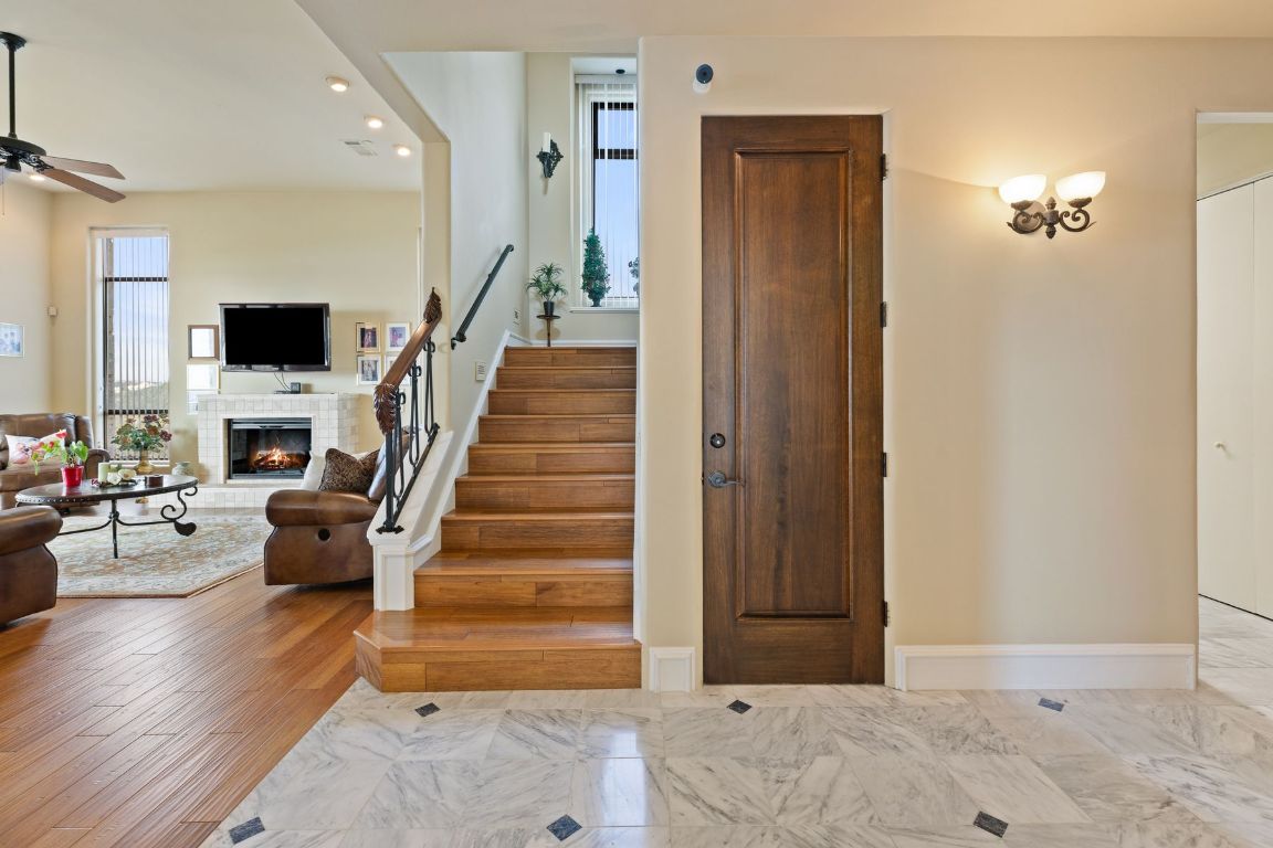 12600 Lyndon Drive Austin, TX 78732 - Photo 17 of 37 a view of entryway and hall with wooden floor