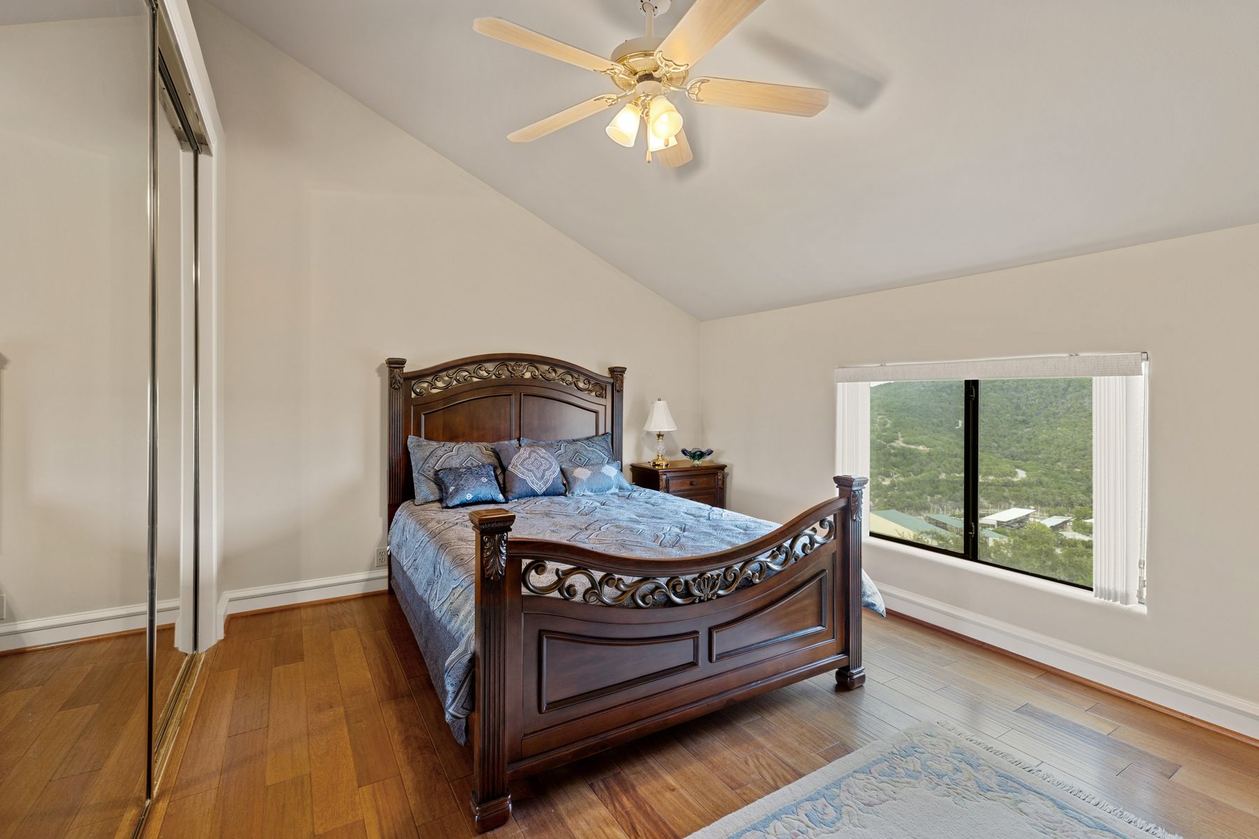 12600 Lyndon Drive Austin, TX 78732 - Photo 18 of 37 a bedroom with a bed and window