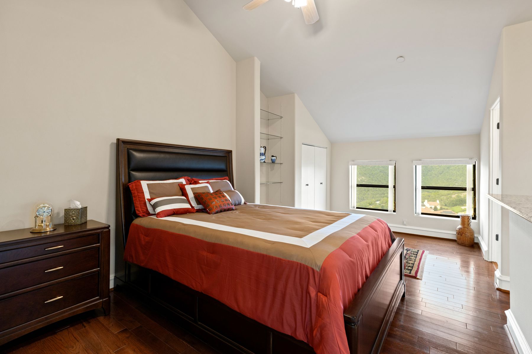 12600 Lyndon Drive Austin, TX 78732 - Photo 19 of 37 a bedroom with a bed and wooden floor