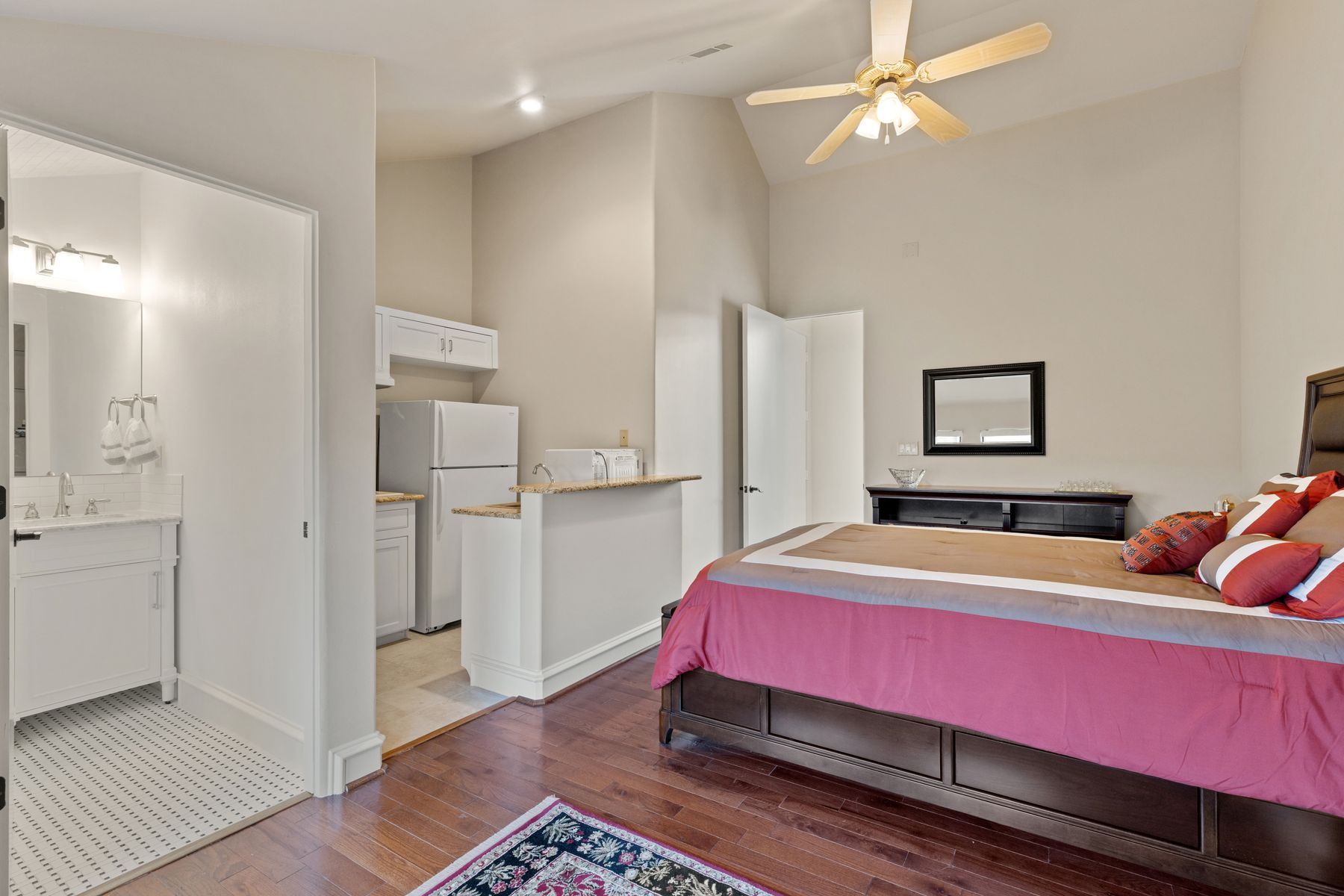 12600 Lyndon Drive Austin, TX 78732 - Photo 20 of 37 a bedroom with a bed and a chandelier