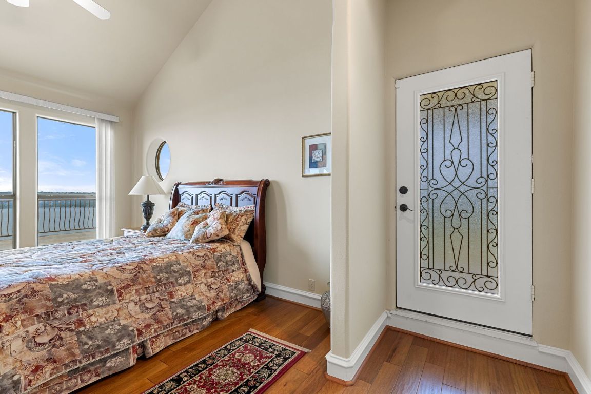 12600 Lyndon Drive Austin, TX 78732 - Photo 24 of 37 a bedroom with a bed and a window