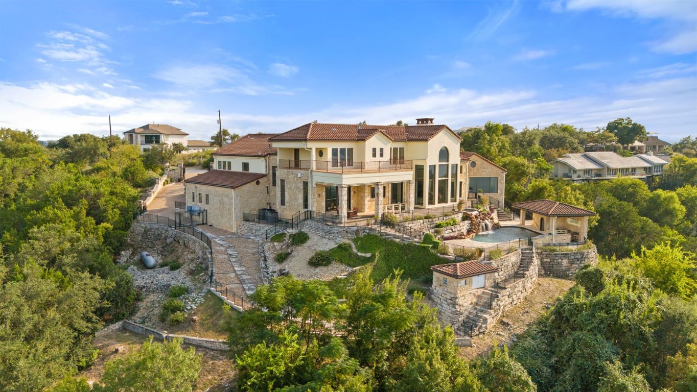 12600 Lyndon Drive Austin, TX 78732 - Photo 26 of 37 a view of a lake with a house in the background