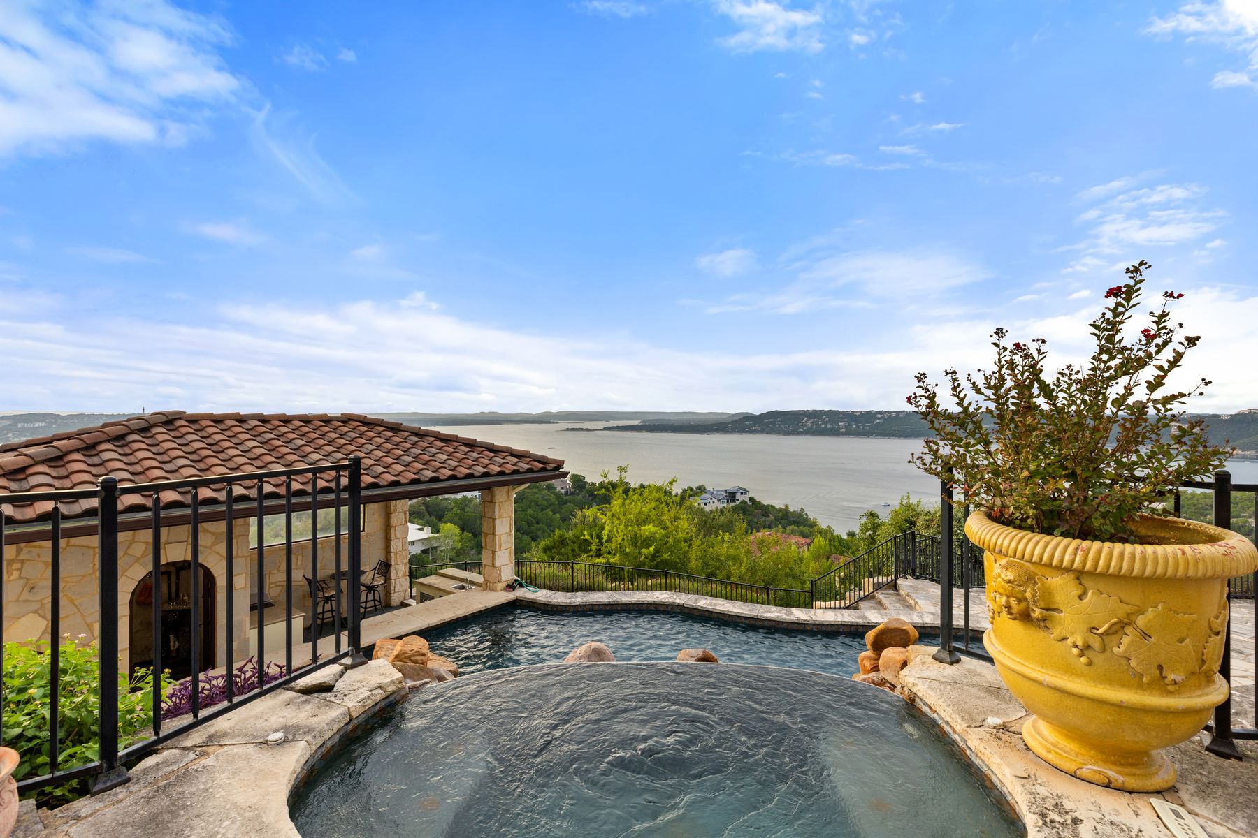 12600 Lyndon Drive Austin, TX 78732 - Photo 28 of 37 a view of a swimming pool with a lounge chair