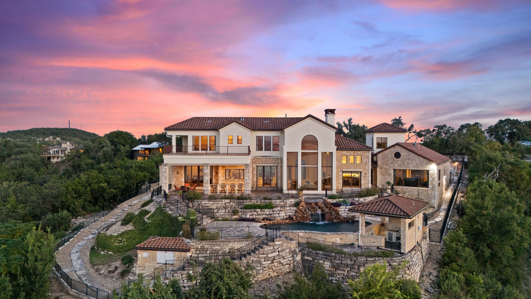 12600 Lyndon Drive Austin, TX 78732 - Photo 35 of 37 a view of a big house with a big yard and potted plants
