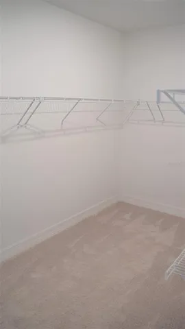 a white toilet sitting next to a white sink