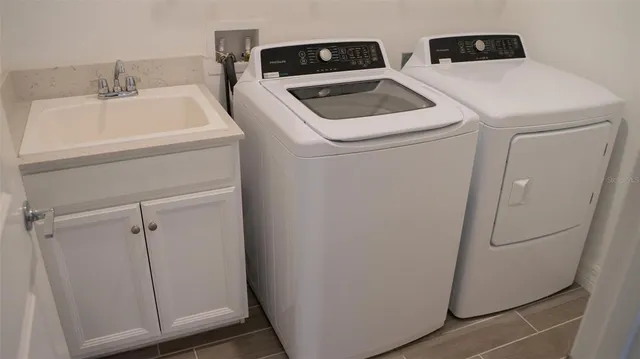 a utility room with dryer and washer