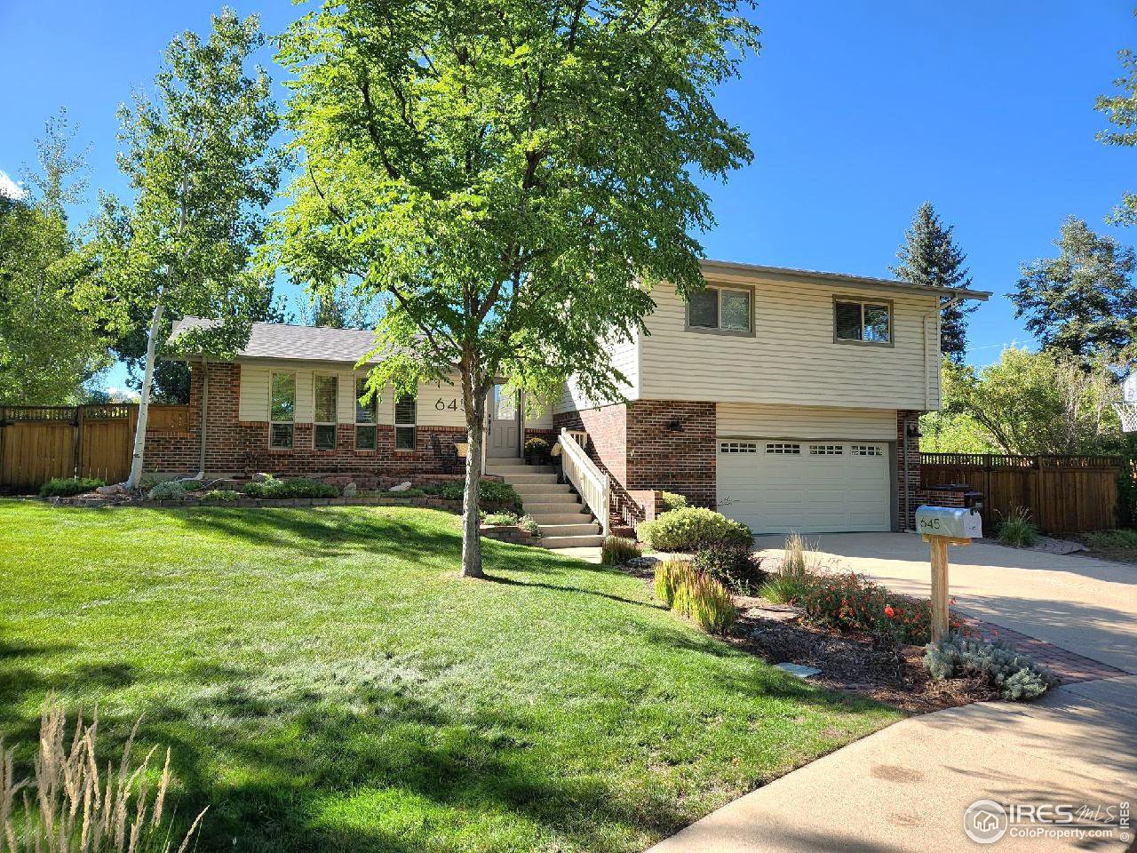 645 Cree Circle Boulder, CO 80303 - Photo 1 of 40 a view of a house with backyard and sitting area