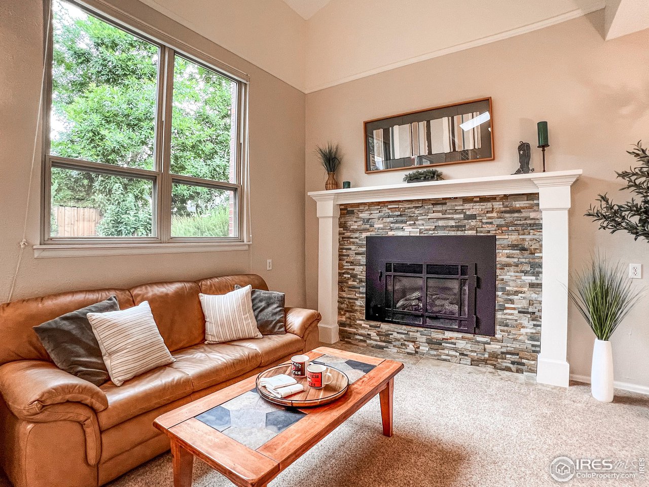 645 Cree Circle Boulder, CO 80303 - Photo 13 of 40 a living room with furniture and a fireplace