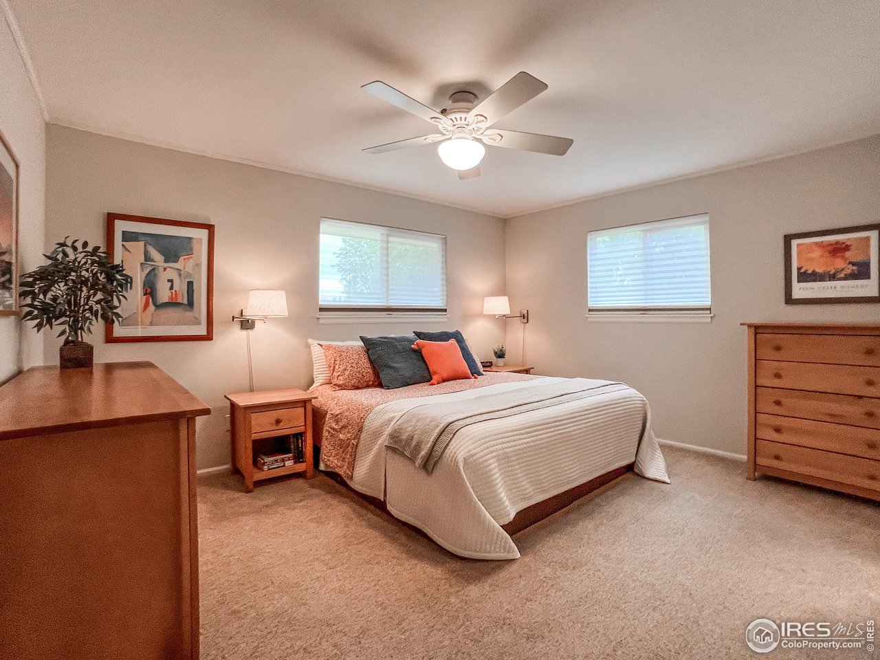 645 Cree Circle Boulder, CO 80303 - Photo 16 of 40 a bedroom with bed and paintings on the wall