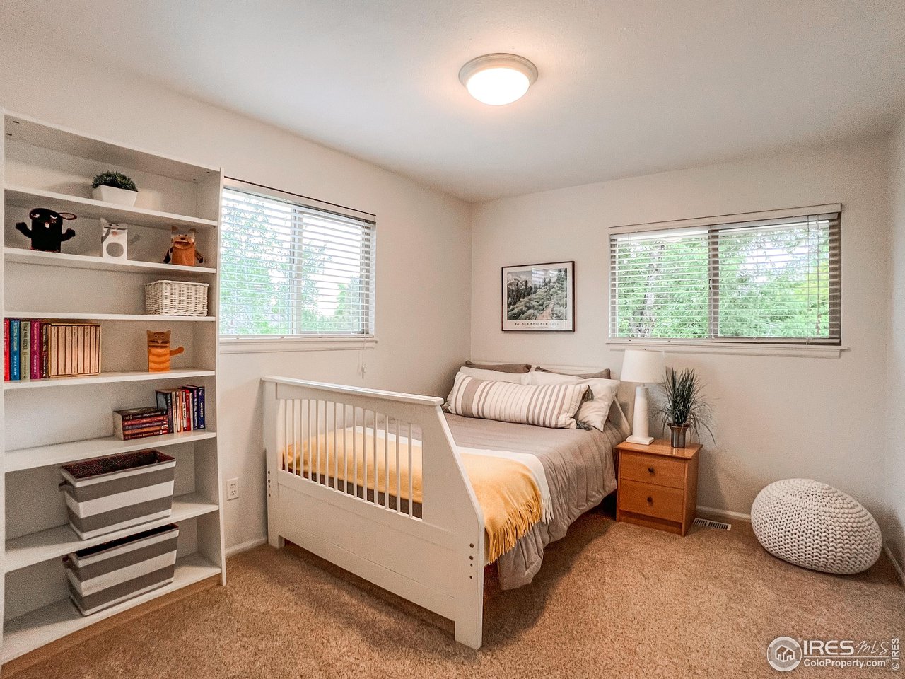 645 Cree Circle Boulder, CO 80303 - Photo 19 of 40 a bedroom with a bed and a window