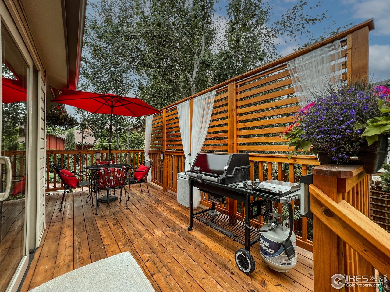 645 Cree Circle Boulder, CO 80303 - Photo 31 of 40 a view of balcony with wooden floor and outdoor seating