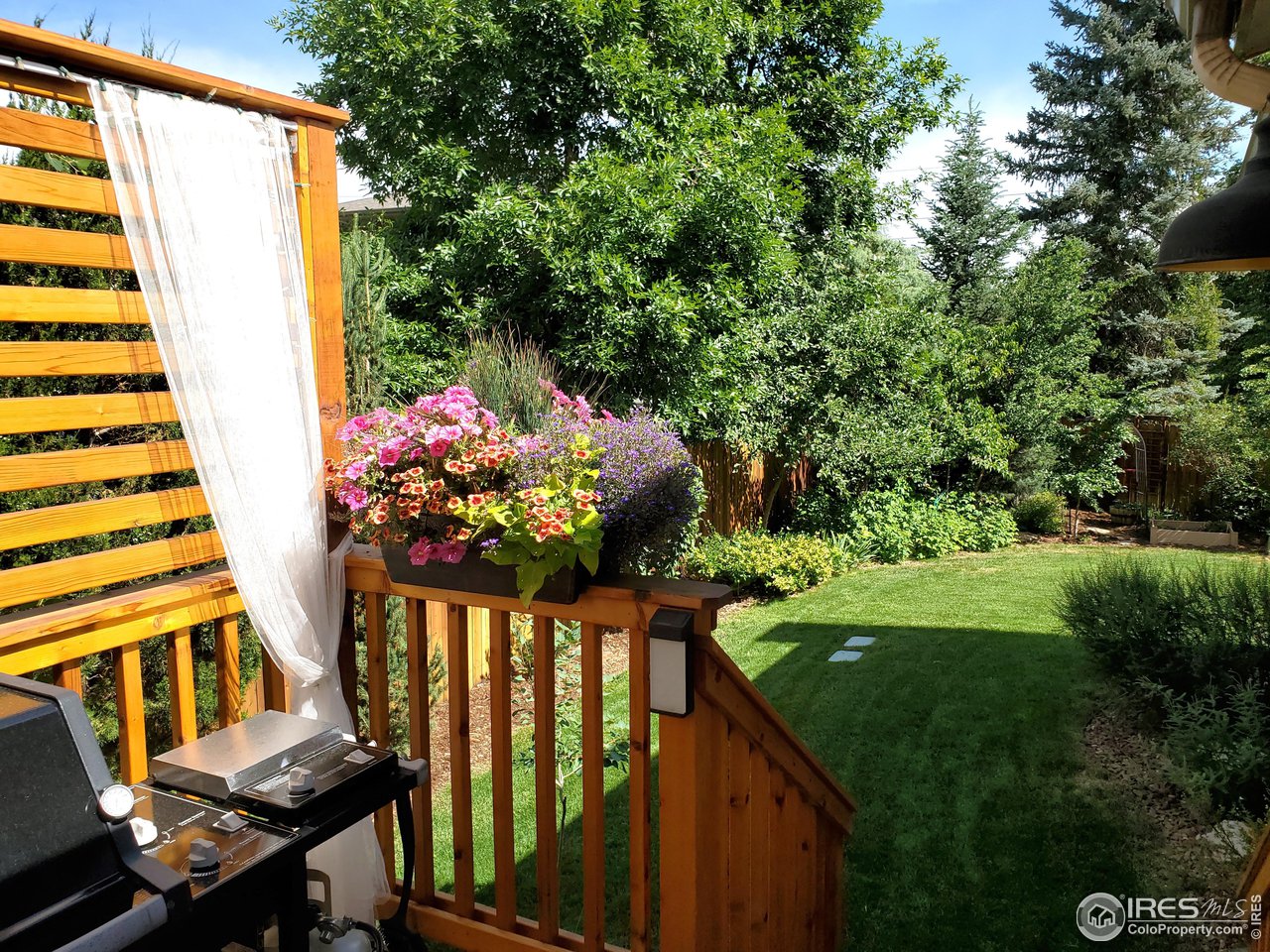 645 Cree Circle Boulder, CO 80303 - Photo 33 of 40 a view of a balcony with wooden floor and fence