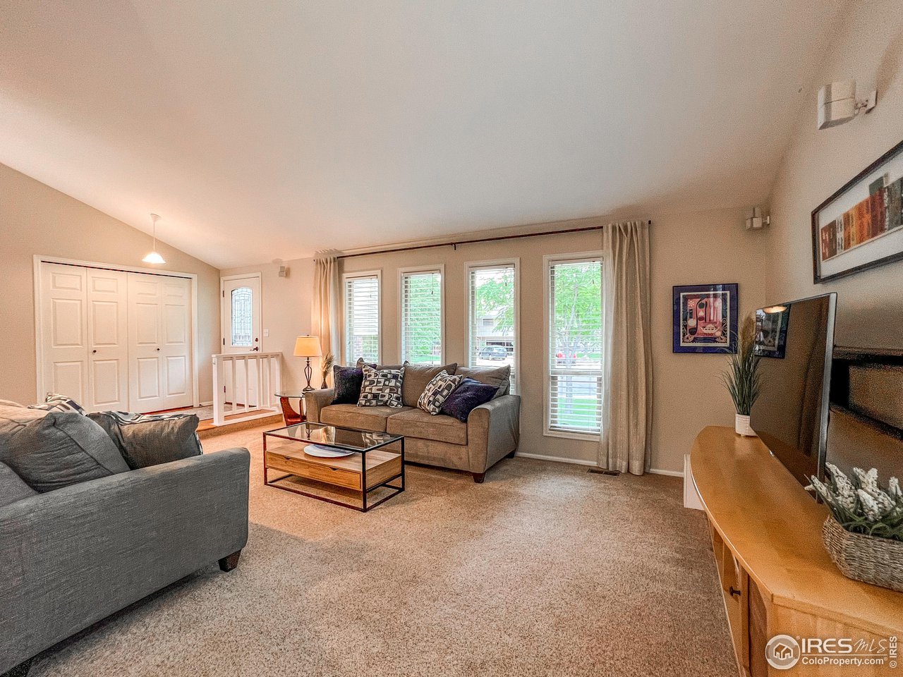 645 Cree Circle Boulder, CO 80303 - Photo 5 of 40 a living room with furniture and a flat screen tv