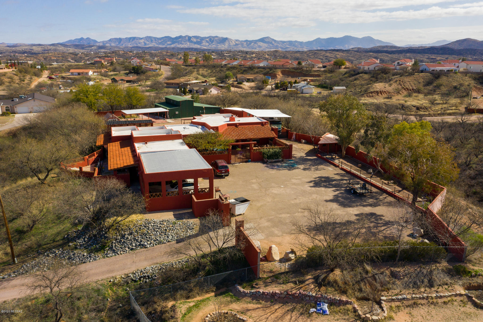 893 Gecko Lane Rio Rico, AZ 85648 - Photo 3 of 40 an aerial view of a houses with a lake