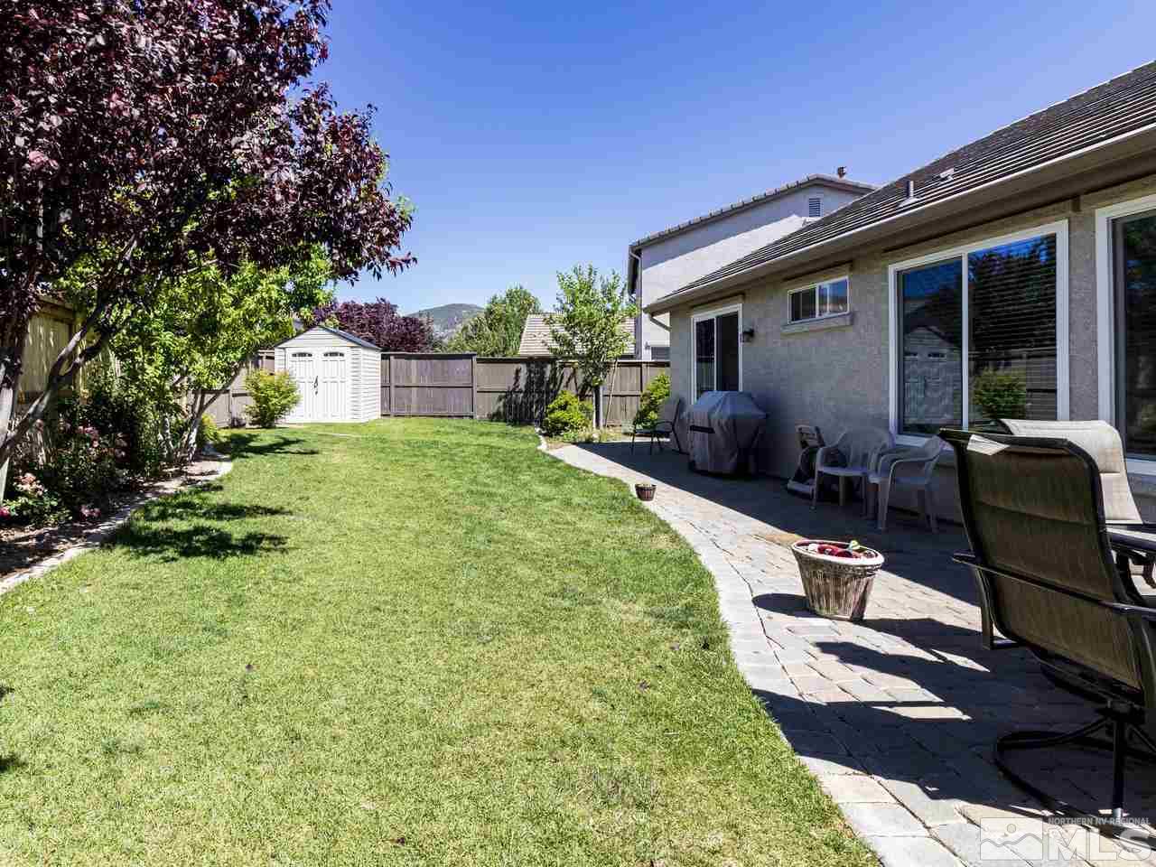 417 Alysheba Court Reno, NV 89521 - Photo 23 of 25 a view of a house with backyard sitting area and garden