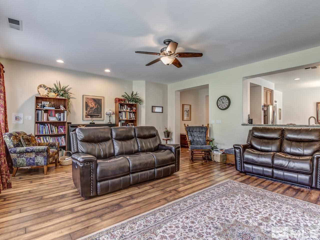 417 Alysheba Court Reno, NV 89521 - Photo 3 of 25 a living room with furniture and a wooden floor