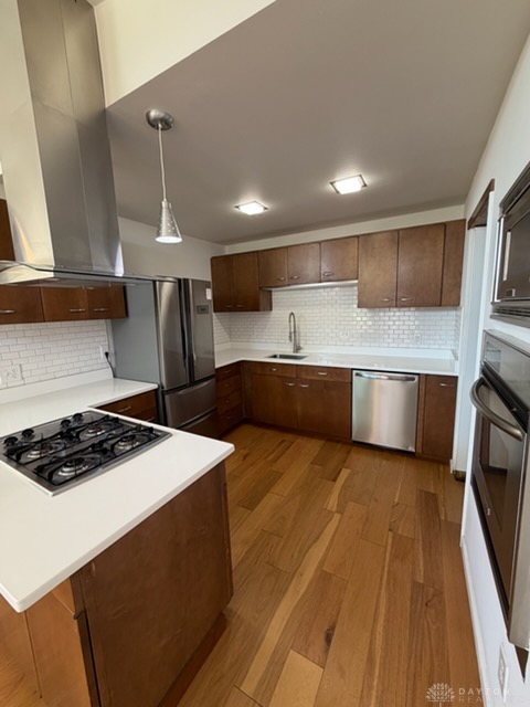 4924 Bayside Drive Riverside, OH 45431 - Photo 7 of 21 This sleek kitchen features modern appliances and rich hardwood floors, perfect for culinary endeavors.