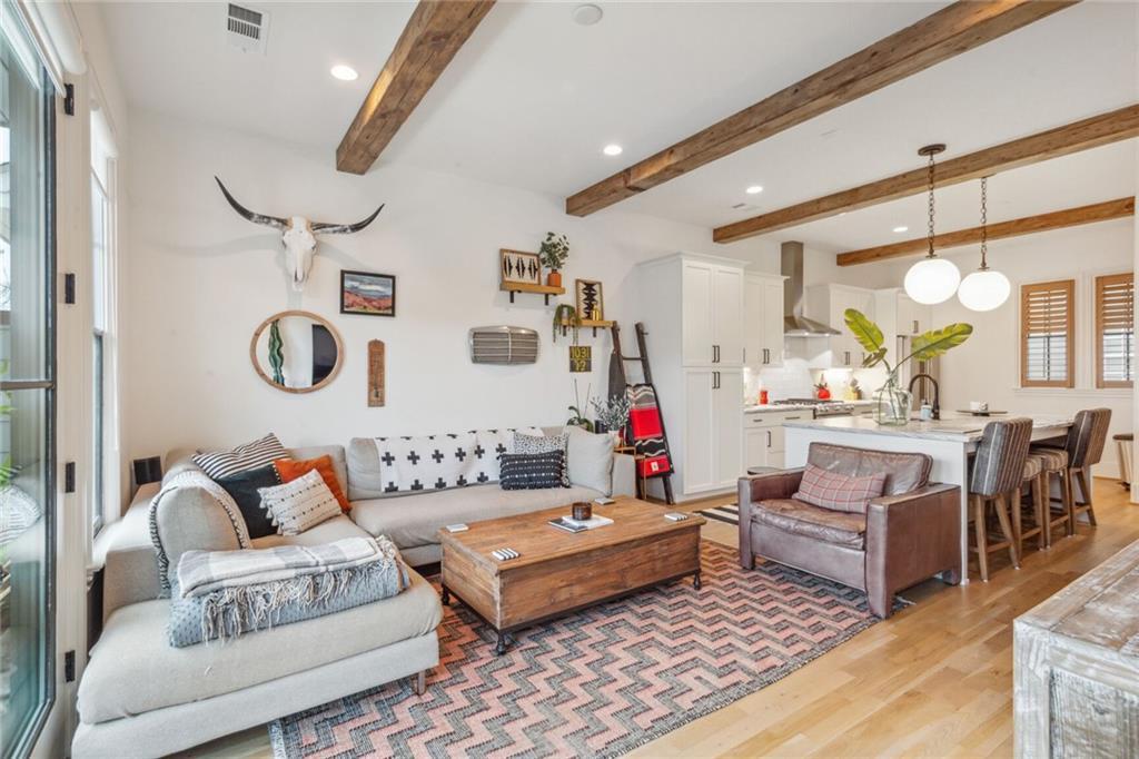677 Reed Street Southeast Atlanta, GA 30315 - Photo 1 of 1 a living room with furniture and wooden floor