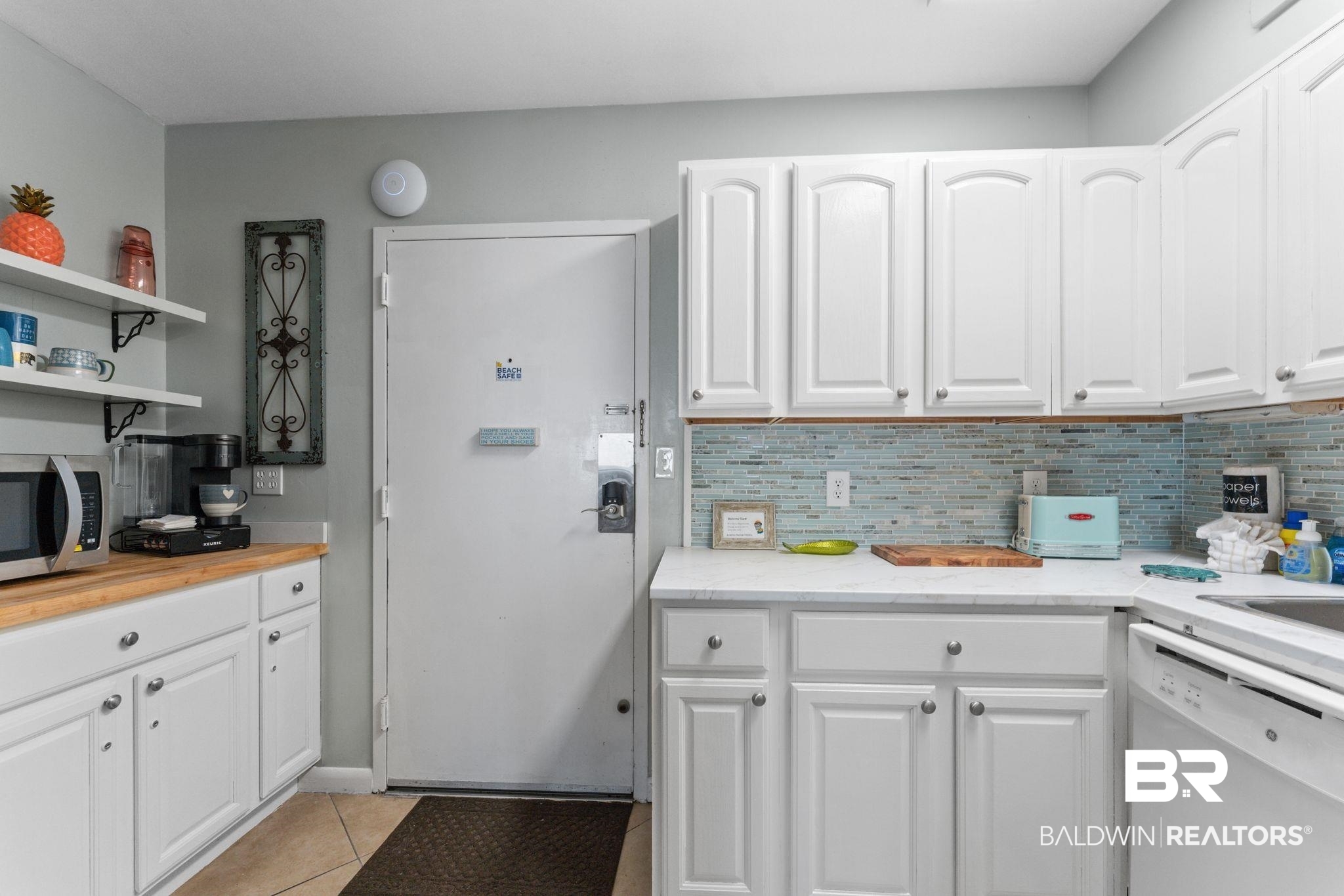 375 Plantation Road, Unit 5803 Gulf Shores, AL 36542 - Photo 7 of 37 Kitchen with white cabinetry, dishwasher, open shelves, stainless steel microwave, and tasteful backsplash