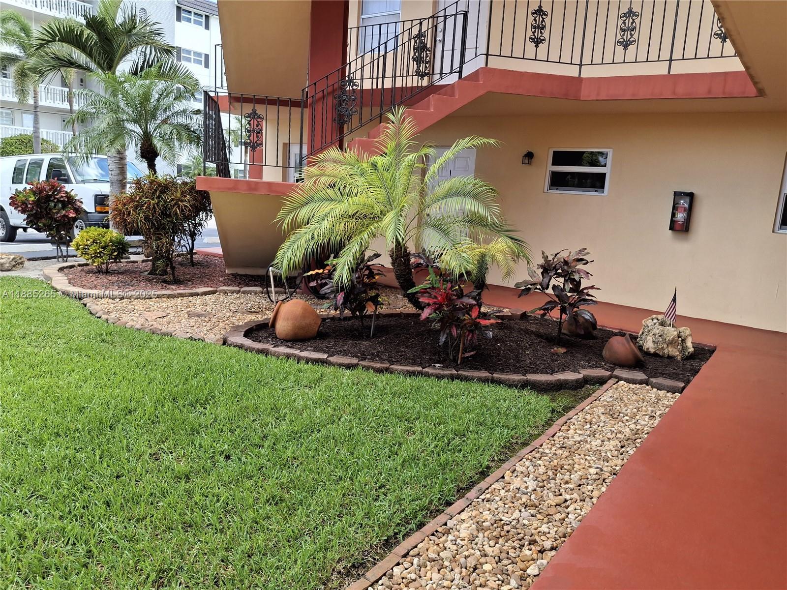 5050 Bayview Drive, Unit 20 Fort Lauderdale, FL 33308 - Photo 1 of 10 a view of a backyard with plants and a patio