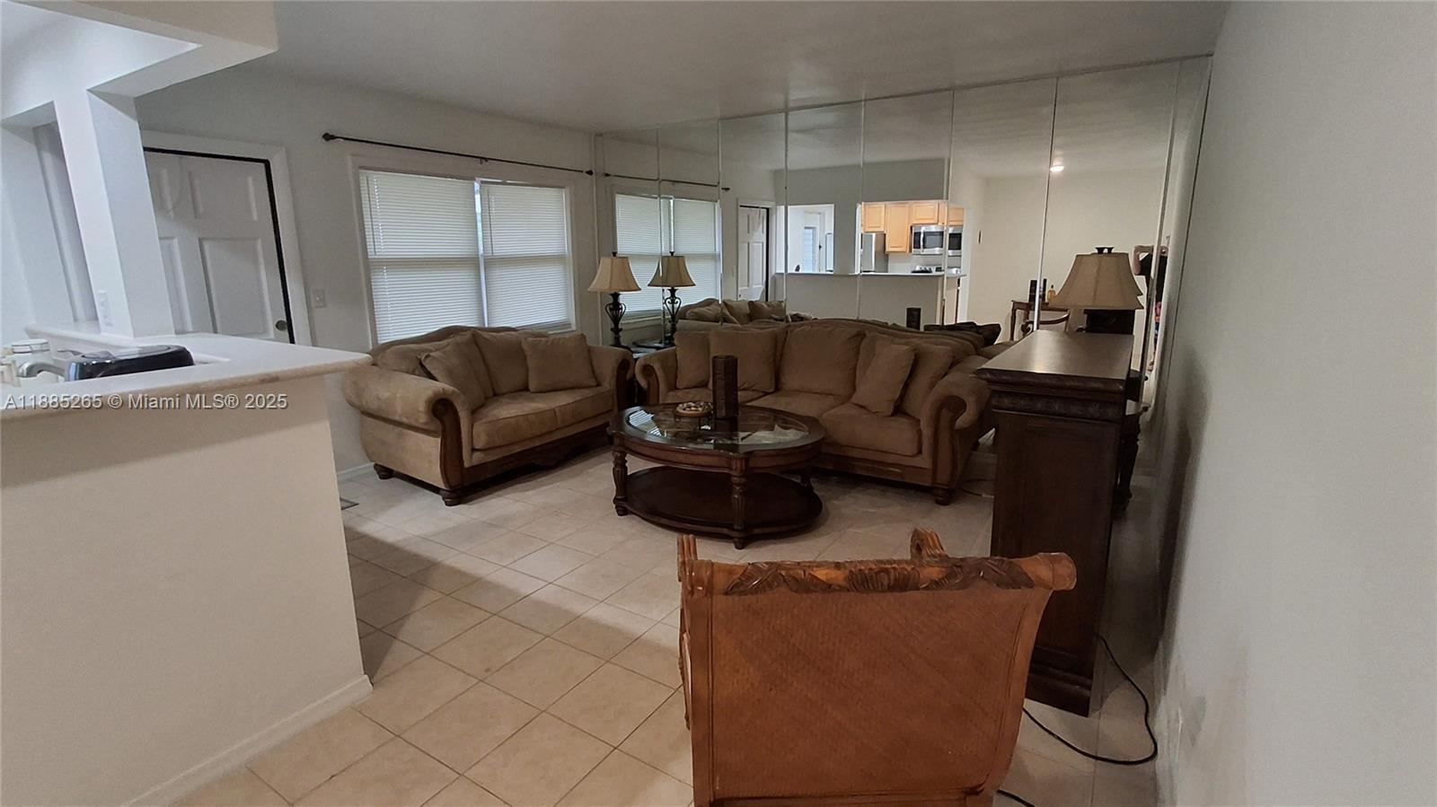 5050 Bayview Drive, Unit 20 Fort Lauderdale, FL 33308 - Photo 8 of 10 a living room with furniture a couch and a window