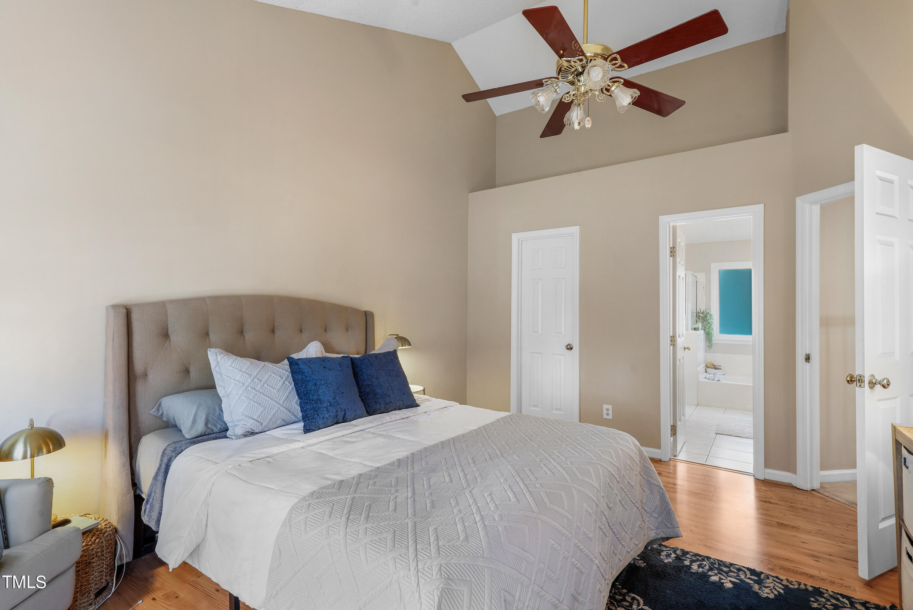 3632 Epperly Court Raleigh, NC 27616 - Photo 11 of 26 a bedroom with a bed and a chandelier