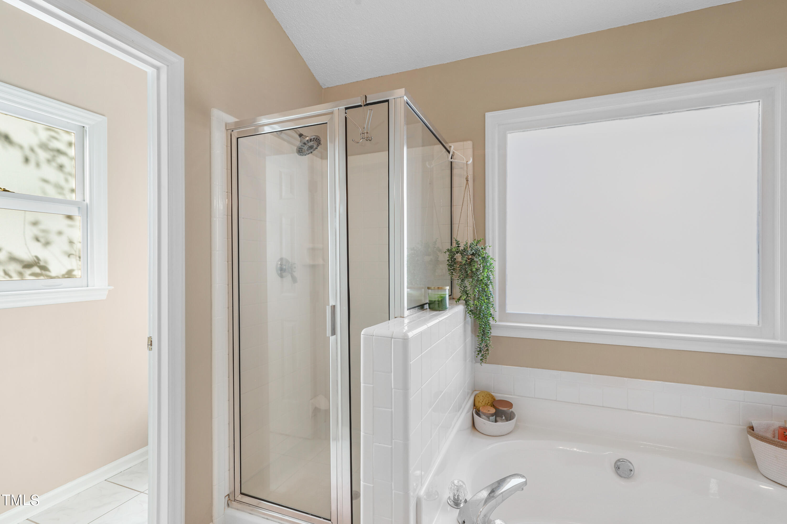 3632 Epperly Court Raleigh, NC 27616 - Photo 14 of 26 a bathroom with a shower and a tub