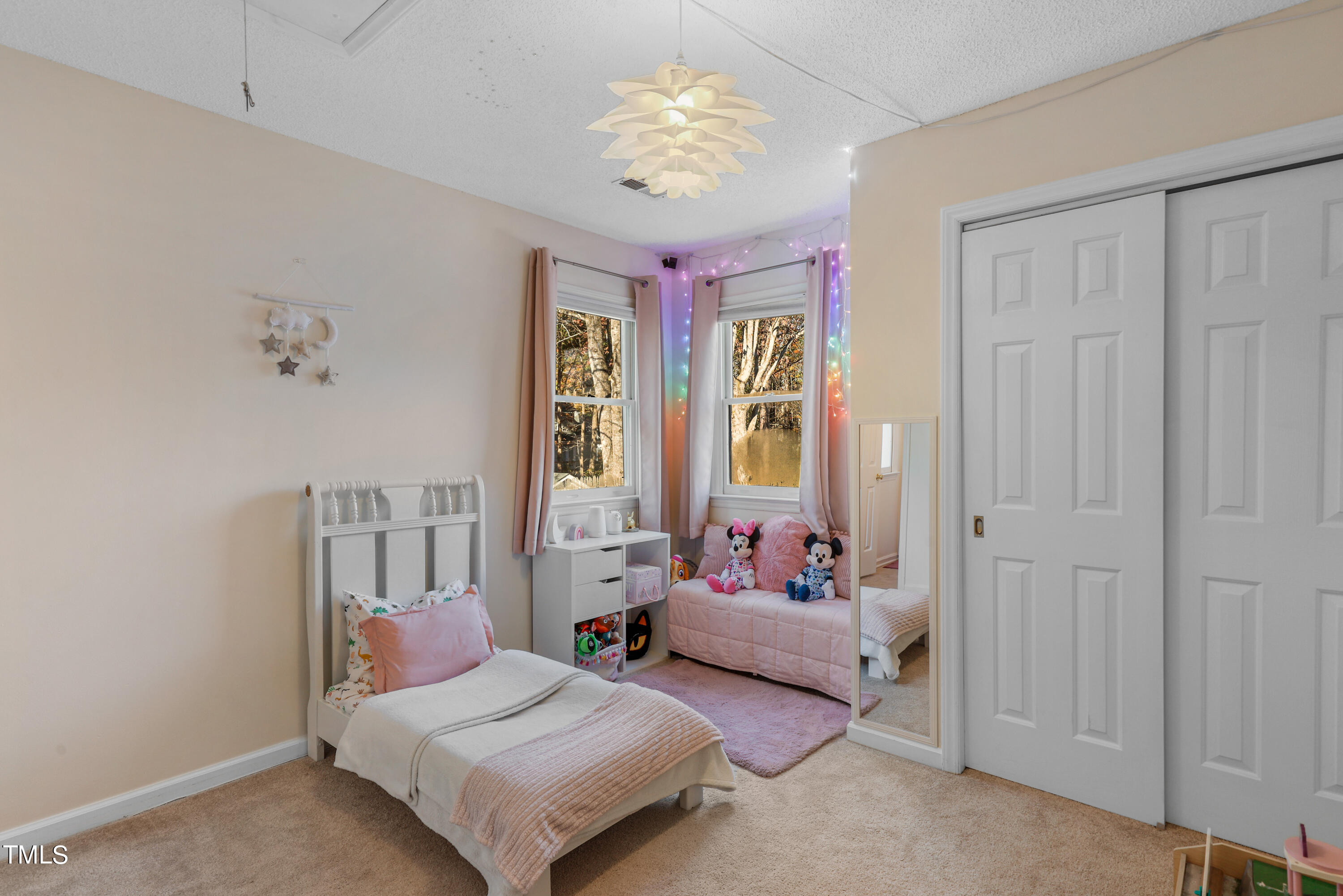 3632 Epperly Court Raleigh, NC 27616 - Photo 15 of 26 a bedroom with furniture and a large window