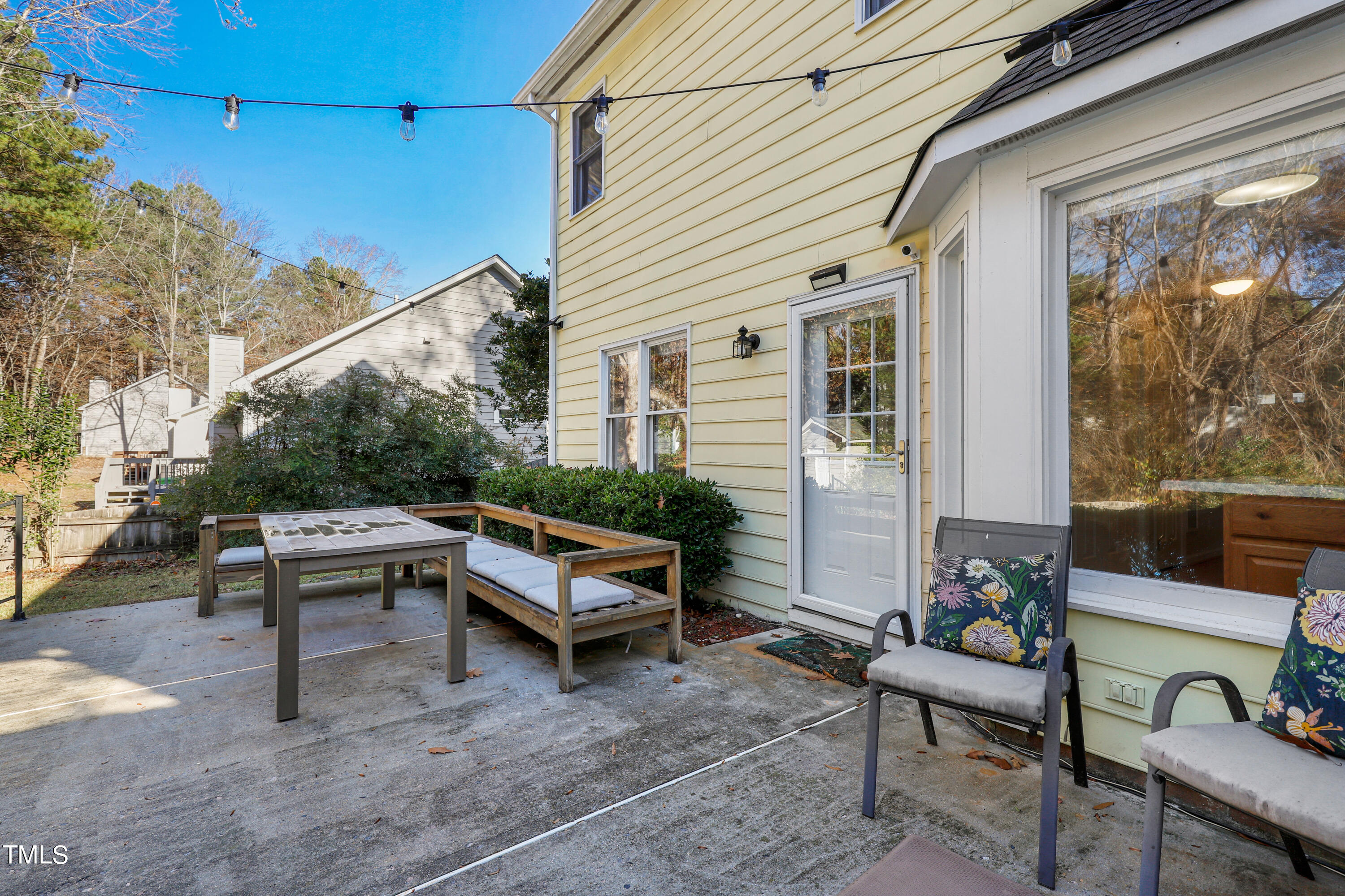 3632 Epperly Court Raleigh, NC 27616 - Photo 23 of 26 a view of a patio with couches table and chairs and potted plants