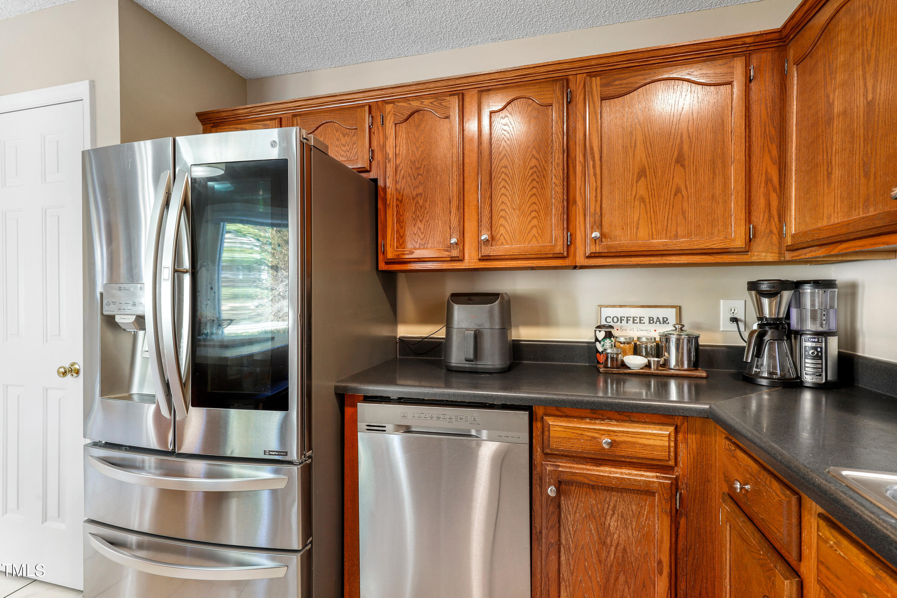 3632 Epperly Court Raleigh, NC 27616 - Photo 7 of 26 a kitchen with stainless steel appliances granite countertop a refrigerator and a stove