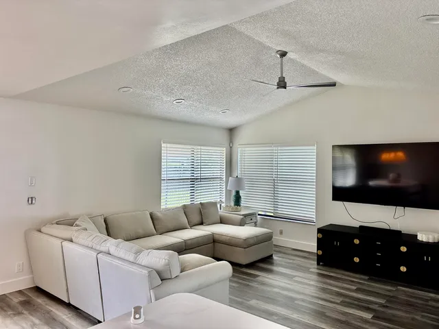 a view of a backyard with a swimming pool