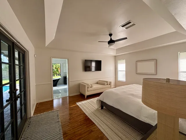 a room with a large window and a table