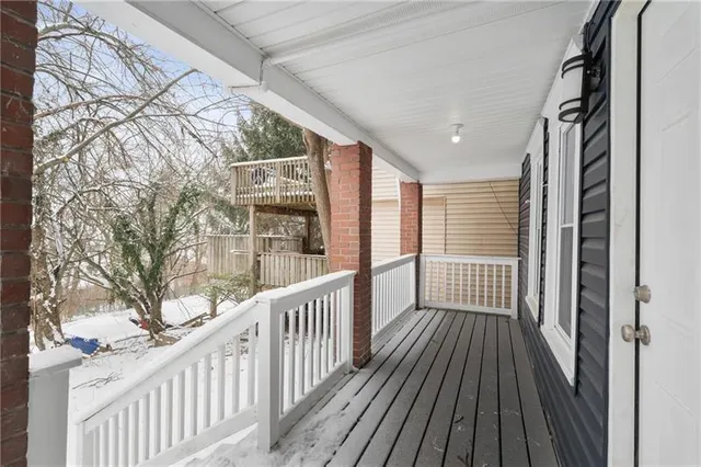 a view of a balcony with wooden floor