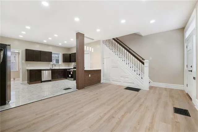 a view of kitchen with microwave and cabinets