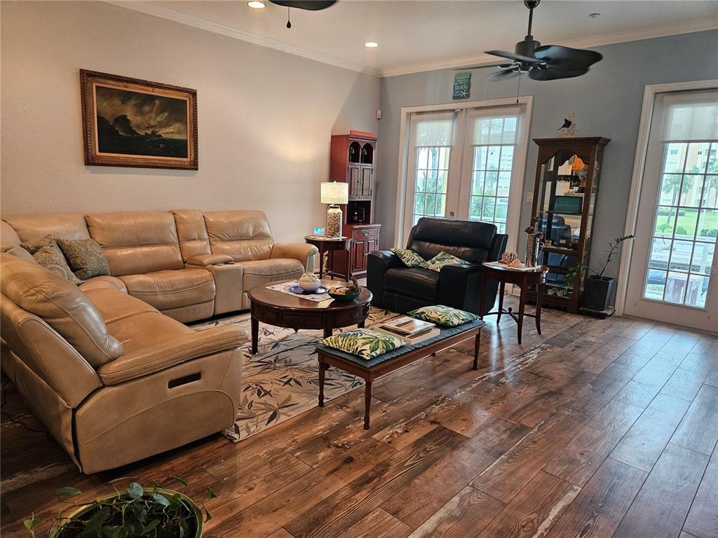 668 American Legion Drive Madeira Beach, FL 33708 - Photo 14 of 49 a living room with furniture a wooden floor and a window