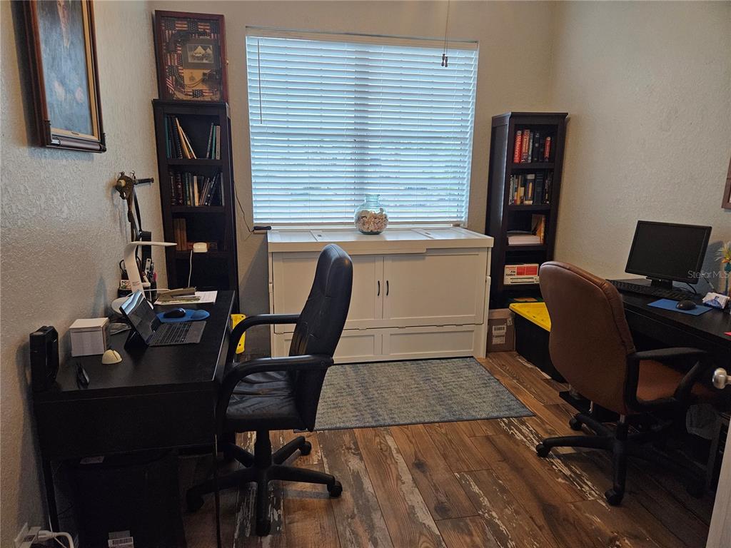 668 American Legion Drive Madeira Beach, FL 33708 - Photo 21 of 49 a view of a workspace with furniture and a window