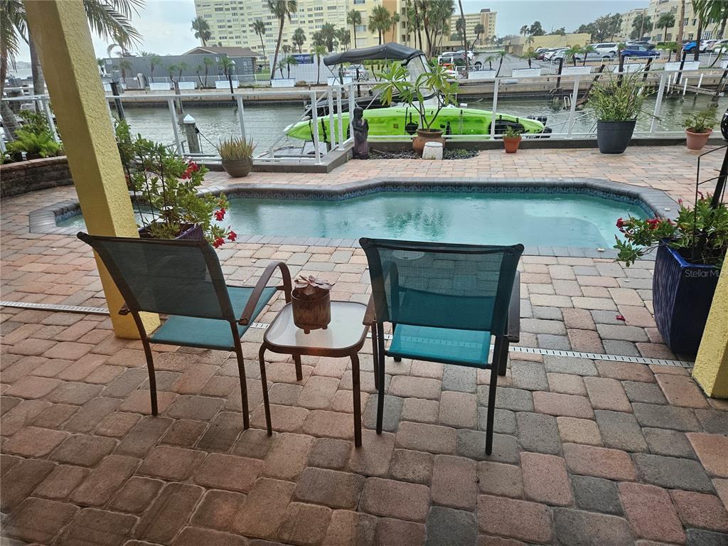 668 American Legion Drive Madeira Beach, FL 33708 - Photo 8 of 49 a view of an chairs and table in the patio