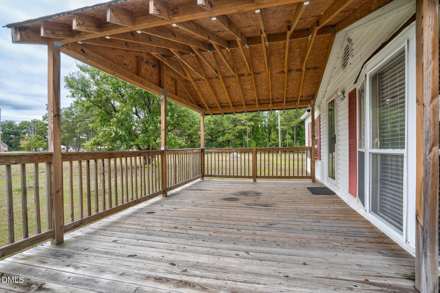 1835 Cokey Road Rocky Mount, NC 27801 - Photo 5 of 42 a view of backyard with wooden floor and iron fence