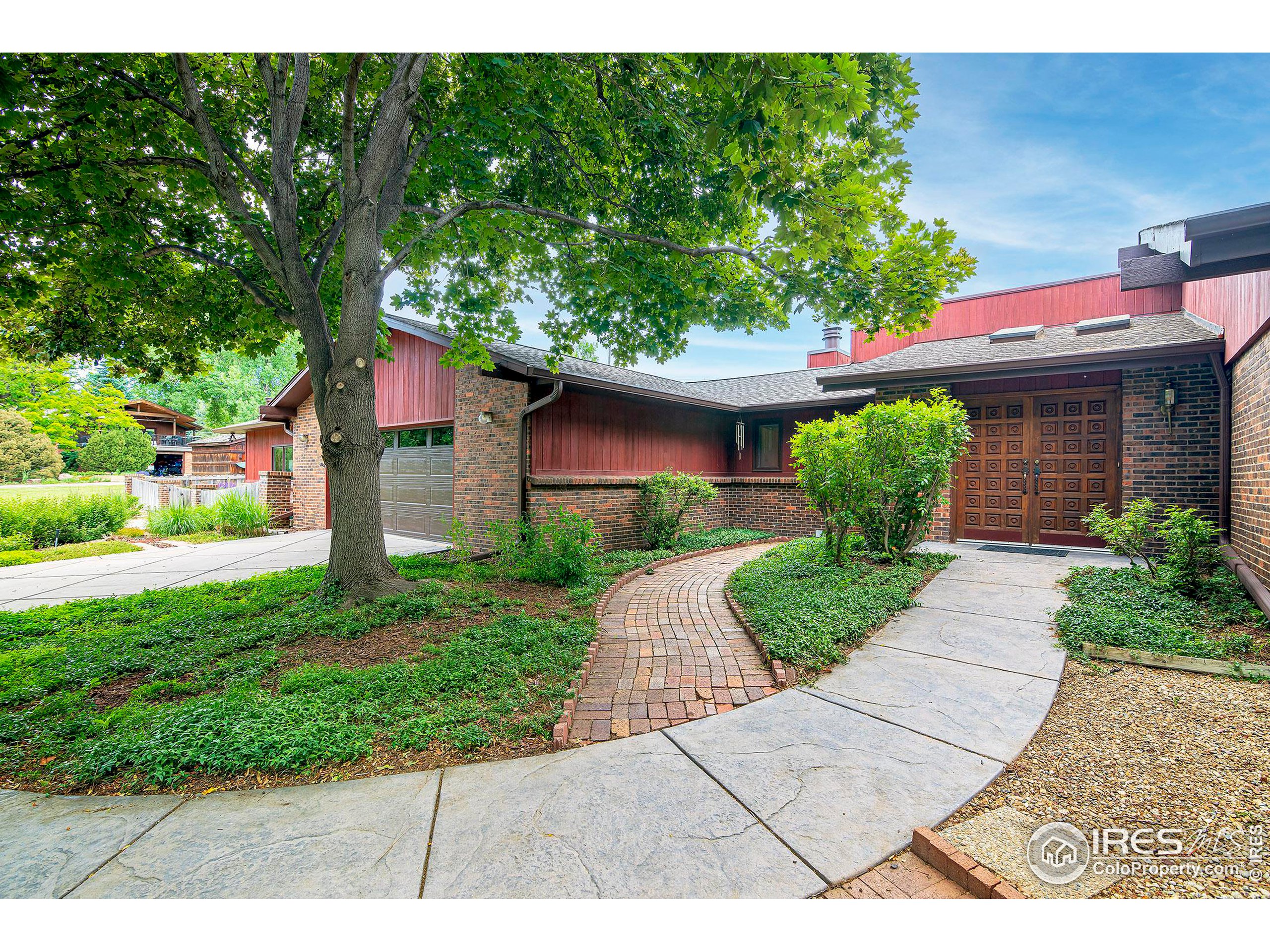 7700 O Connor Road Boulder, CO 80303 - Photo 1 of 40 a front view of a house with a yard
