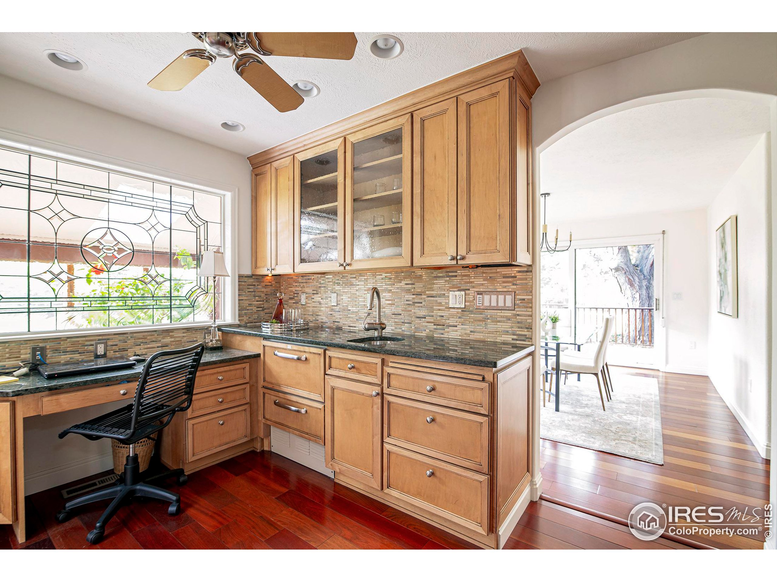 7700 O Connor Road Boulder, CO 80303 - Photo 20 of 40 a kitchen with granite countertop a stove a sink and a microwave
