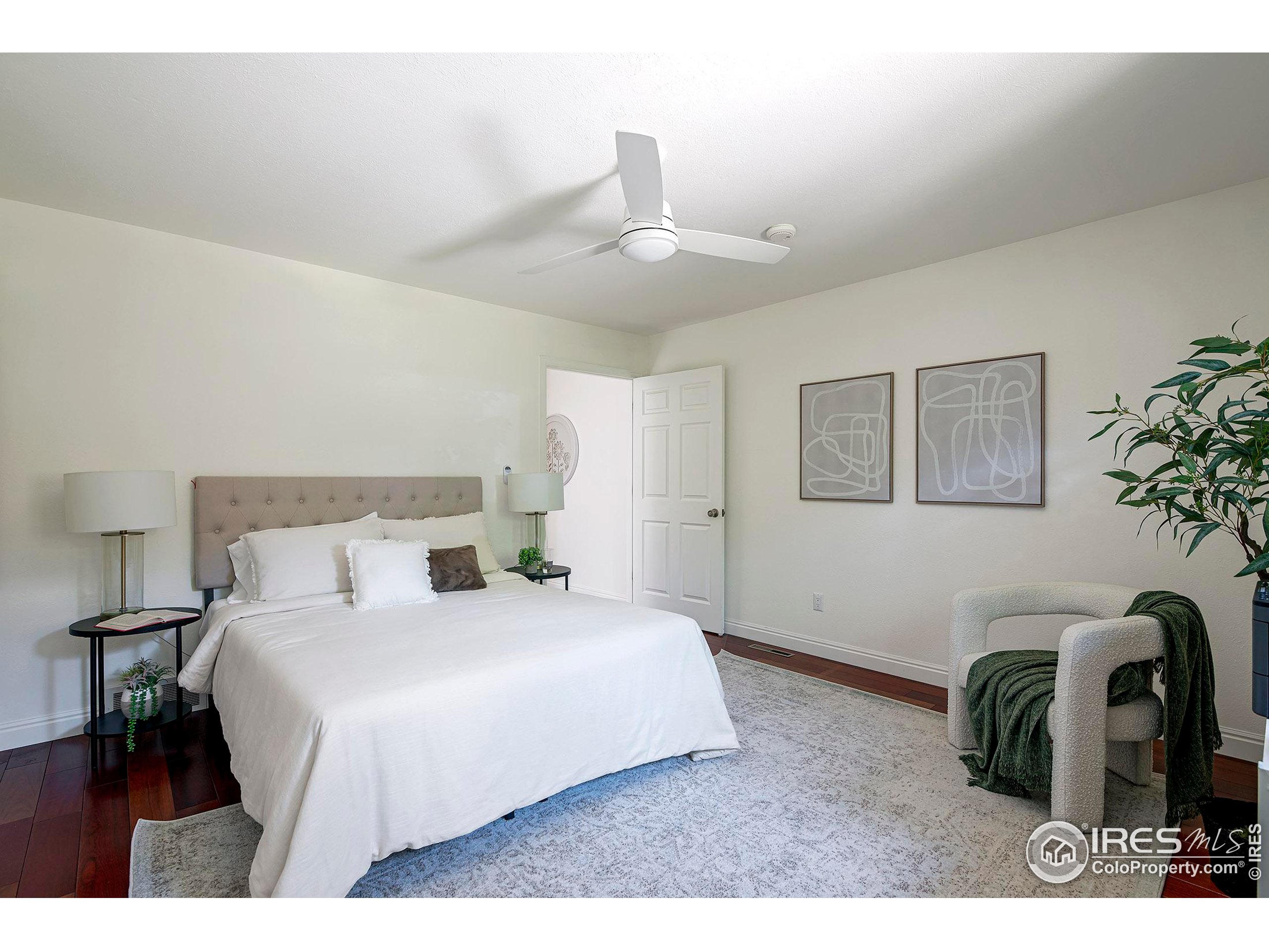 7700 O Connor Road Boulder, CO 80303 - Photo 28 of 40 a bedroom with a bed and a chandelier