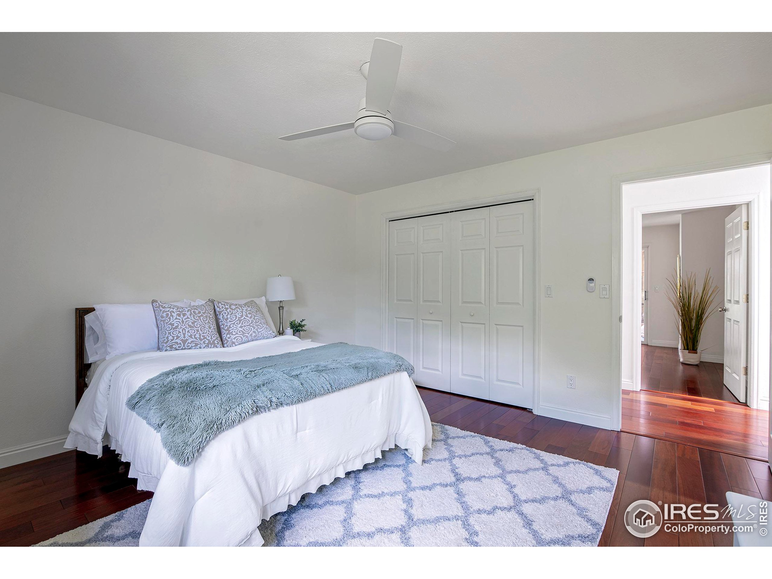 7700 O Connor Road Boulder, CO 80303 - Photo 29 of 40 a bedroom with a bed and a view of bathroom